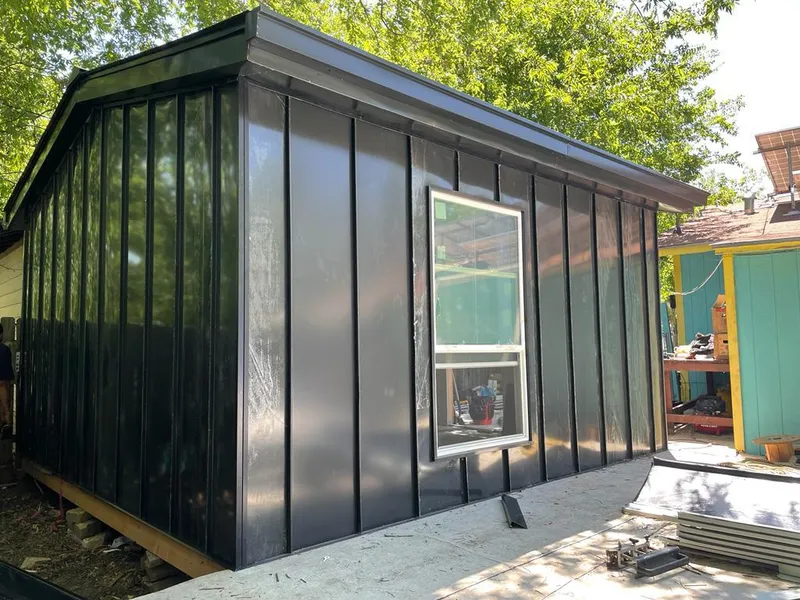 Black standing seam metal wall panels for Roof Inspection in Burleson