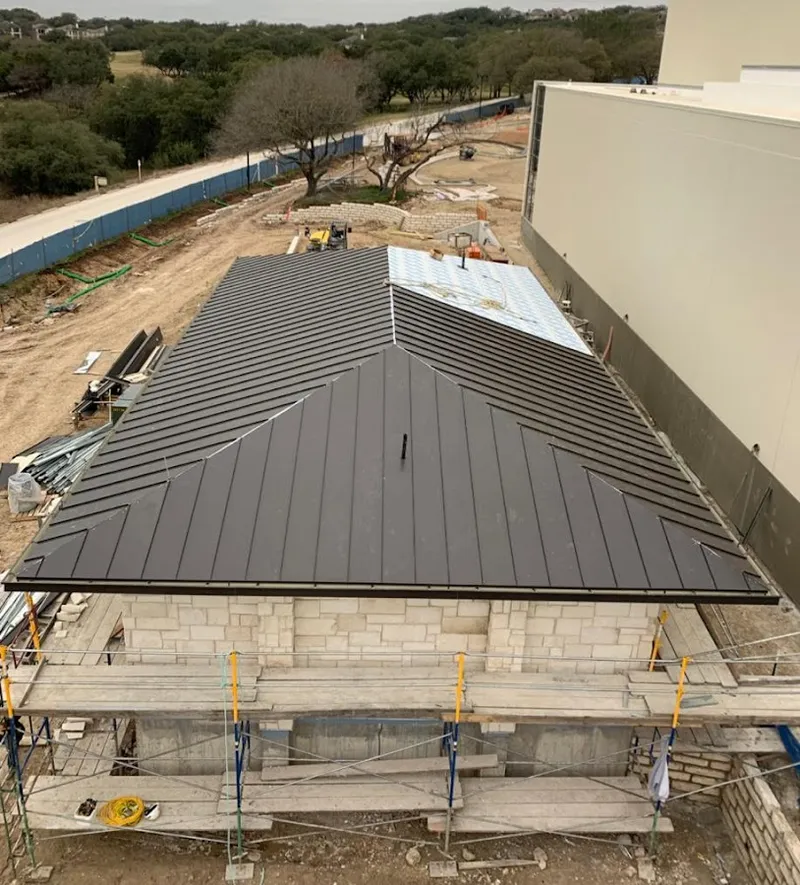 Metal roof new construction with scaffolding in Burleson