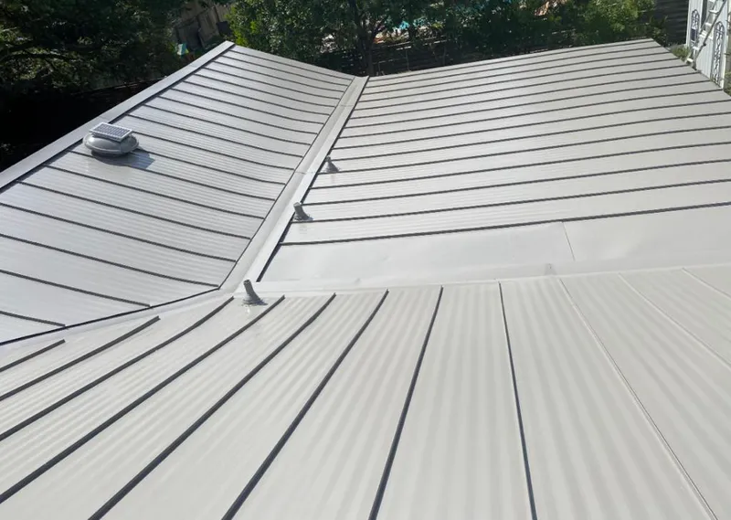 Solar attic fan installed on a metal roof for Roof Ventilation in Burleson
